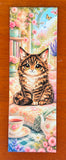 Cute cat bookmark with fluffy chibi cat, floral reading nook, tea set, flowers, and matte or laminated finish options.