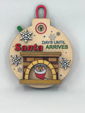 Hanging wood advent calendar ornament with Santa and snowflake fireplace details