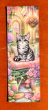 Cat lover bookmark featuring a silver tabby cat with flowers butterflies and soft garden details
